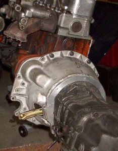 This photo shows the bell housing attached to the engine and transmission. I found it quite easy to install the tranny with the engine out of the car.